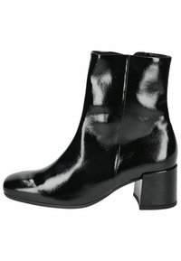 Bottines vernis noires à bout arrondi, avec un léger talon et une texture lisse. Présente un design épuré et une surface brillante.