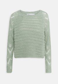 Hellgrüner Strickpullover mit strukturiertem Muster, ausgestattet mit einem gerippten Ausschnitt und Bündchen sowie Lochmuster-Details an den Ärmeln.