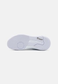 White athletic shoe sole with a hexagonal pattern, featuring a smooth texture and embossed logo. Includes black "Michelin" accent.