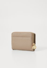 Beige leather wallet with textured surface, featuring a zip closure, single card slot on the front, and gold-tone hardware.