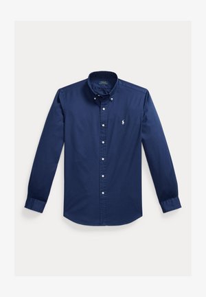 Granatowa, długorękawowa koszula na guziki z białymi guzikami i małym, białym haftowanym logo Polo Ralph Lauren na piersi.