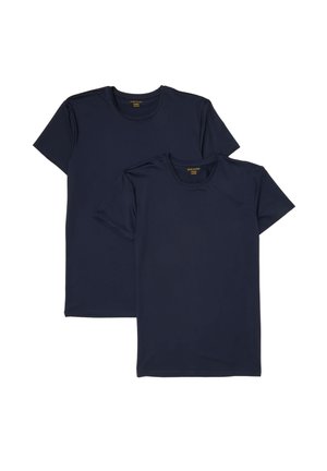 Dos camisetas lisas azul marino oscuro de manga corta y cuello redondo, una ligeramente superpuesta delante de la otra sobre un fondo blanco.