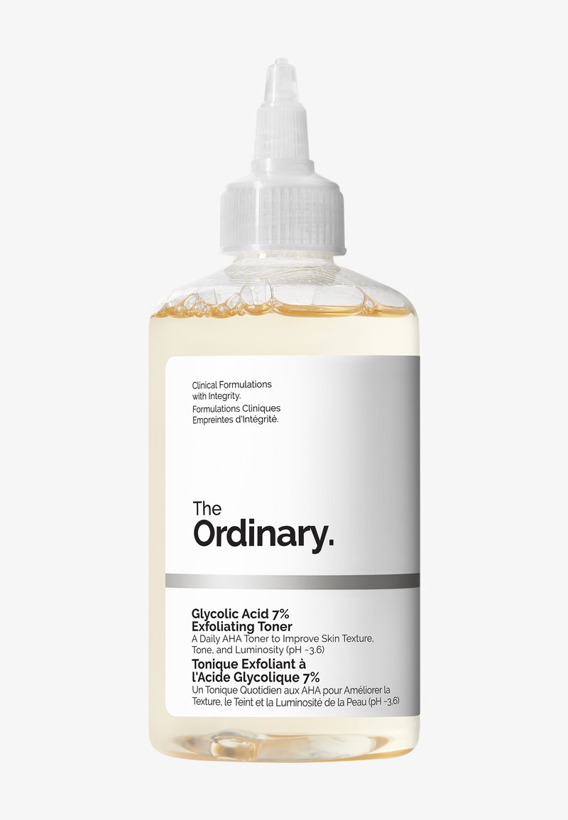 Clear bottle of The Ordinary Glycolic Acid 7% Exfoliating Toner with white label and pointed white cap against white background.