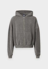 Grauer Reißverschluss-Hoodie mit Kapuze, geripptem Muster, seitlichen Taschen und lockerer Passform. Verfügt über silberne Hardware und elastische Bündchen.