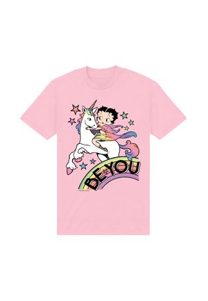 T-shirt rose avec un personnage de dessin animé chevauchant une licorne blanche, entouré d'étoiles colorées et d'un arc-en-ciel avec le texte « SOIS TOI. »