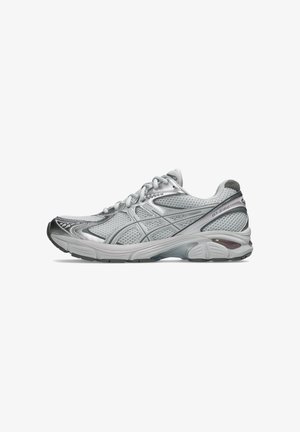 Athletic shoes featuring a mesh upper in silver, with textured overlays, a cushioned sole, and a reinforced toe cap.