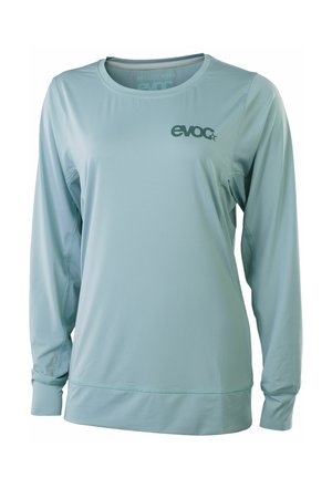 Light blue long-sleeve athletic shirt with crew neck, fitted cuffs, and "evoc" logo on the left chest.