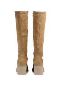 Pair of tall tan suede boots with block heels, visible stitching, and back zipper, shown from the rear on a white background.
