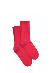 Rote Baumwollsocken mit geripptem Textur, die ein blaues Logo-Detail aufweisen. Das Design ist knöchellang mit einer glatten Oberfläche und ohne Muster.
