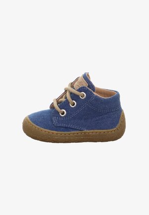 Blue canvas shoe with beige laces, round toe, and textured brown rubber sole. Features stitched accents and a low-top design.