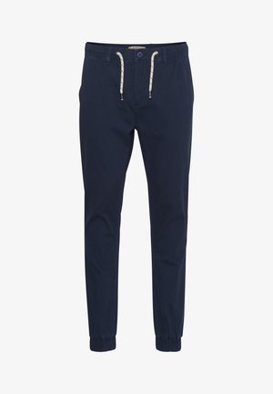 Granatowe dresowe spodnie wykonane z mieszanki bawełny, z elastycznym pasem z trokami, dwoma bocznymi kieszeniami i elastycznymi mankietami.