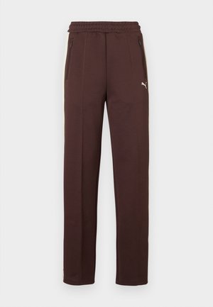 Pantaloni da ginnastica marroni con finitura testurizzata, vita elastica, tasche laterali con cerniere e accento logo sulla gamba sinistra.