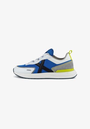 Blue and white athletic shoe with black accents, suede gray heel, and neon yellow heel tab. Features textured fabric and smooth leather elements.