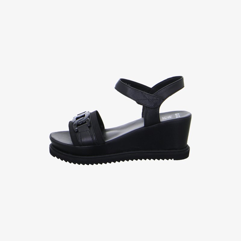 Black wedge sandal with ankle strap, open toe, and decorative buckle on front strap, displayed on a white background.