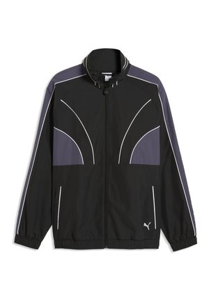 Veste de survêtement Puma noire avec panneaux gris, passepoil blanc, fermeture zippée intégrale, poignets et ourlet élastiques, et logo Puma en bas devant.