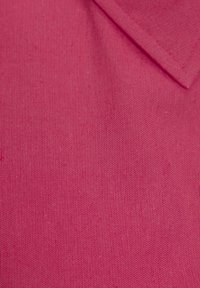 Fuchsia cotton fabric with a smooth texture; features a folded collar and subtle weave pattern. Uniform color with no additional details.