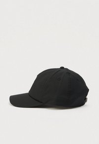 Black six-panel baseball cap with curved brim and adjustable strap shown on a plain light background from the side.