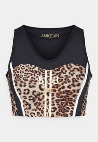 Brassière de sport noire avec panneau avant imprimé léopard, rayures verticales dorées, numéro "510" imprimé en or, et accents latéraux blancs.