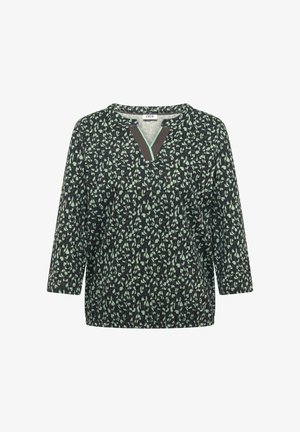 Blusa a maniche lunghe con motivo nero e verde, scollo a V con bordo scuro e striscia decorativa verde menta.