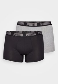 Black and grey boxer shorts with elastic waistband featuring PUMA logo. Made from a smooth, stretchy material, ensuring a comfortable fit.