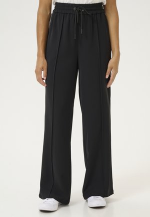 Schwarze, weite Hose mit einem elastischen Bund und Kordelzug, ausgestattet mit einer glatten Textur und zwei vorderen Falten für zusätzlichen Stil.