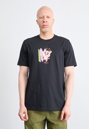 Black cotton t-shirt featuring a colorful cartoon character graphic on the front. Short sleeves, crew neck design.
