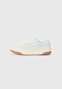 White suede sneaker with light blue accents, round toe, lace-up closure, and a gum rubber outsole featuring perforations along the sides.