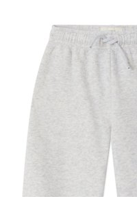 Pantalon de survêtement gris clair avec taille à cordon, texture douce et motif chiné subtil. Poignets élastiques et coupe décontractée.