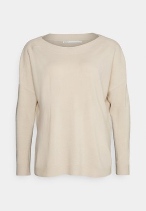Beige knit sweater with a wide crew neckline, long sleeves, and ribbed cuffs. Soft texture, relaxed fit, minimal design with no visible patterns.