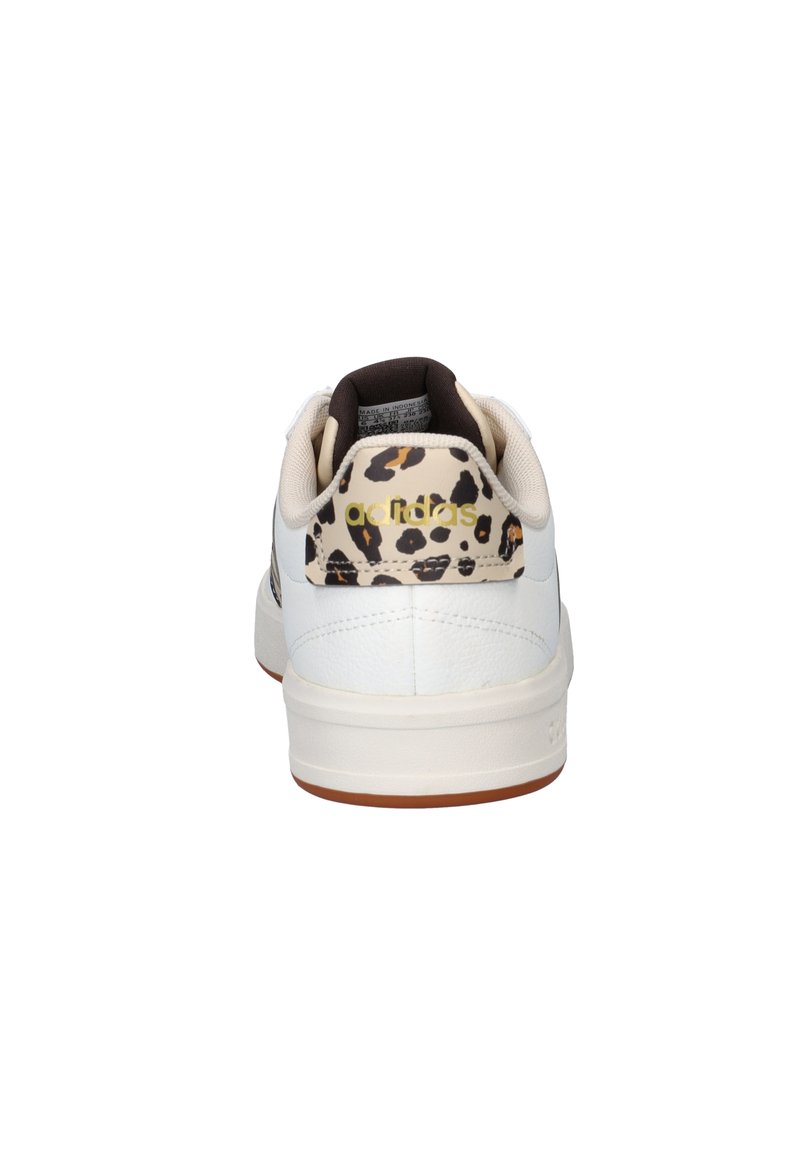 White sneaker featuring a textured leather upper, brown accents, and a leopard print heel with gold branding. Rubber sole.