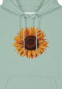 Mintgrüner Hoodie mit einem großen, realistischen Sonnenblumenmotiv, das gelbe Blütenblätter und ein dunkelbraunes Zentrum zeigt. Enthält Schnittzüge und eine Fronttasche.