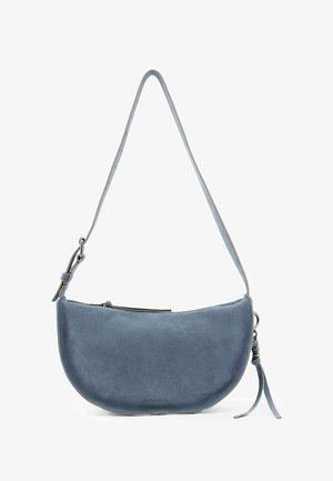 Blue suede half-moon shoulder bag with adjustable strap, zipper closure, and side tassel detail.