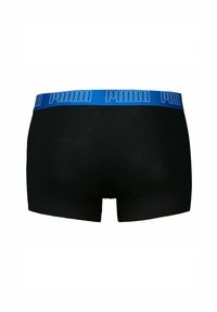 Boxer neri con elastico blu che presenta il logo "PUMA" in bianco. Materiale morbido e design classico dei boxer.