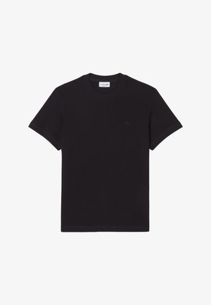 Zwart katoenen T-shirt met korte mouwen, een ronde hals en een klein geborduurd krokodillenlogo op de linkerbovenkant.