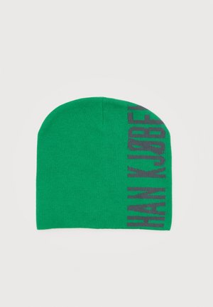 Green knit beanie with dark vertical text "HAN KJØBENHAVN" along one side.