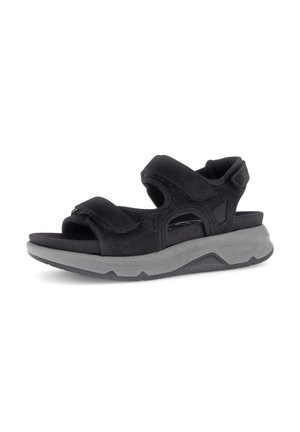 Black sports sandal with adjustable Velcro straps and thick gray cushioned sole, designed for comfort and casual wear.