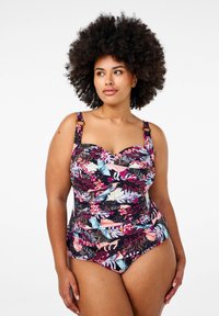 Badpak met een bloemenpatroon in heldere kleuren op een zwarte achtergrond. Voorzien van verstelbare bandjes en een geplooid ontwerp voor een slanke pasvorm.
