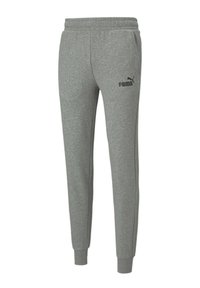 Pantalones jogger de algodón gris con cintura elástica, piernas ajustadas y un pequeño logo negro de Puma en el muslo izquierdo. Textura suave.