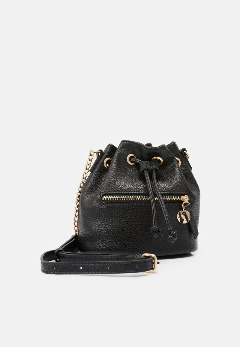 Black bucket bag made of textured leather featuring gold hardware, drawstring closure, and a front zipper pocket with a charm accent.