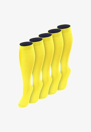 Fünf Paare leuchtend gelber knielanger Socken, in einer versetzten Reihe auf weißem Hintergrund angeordnet.