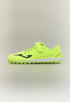 Lys gul løpesko med svart logo, hvit såle, lisser og borrelåsstropp, vist fra siden på en nøytral bakgrunn.