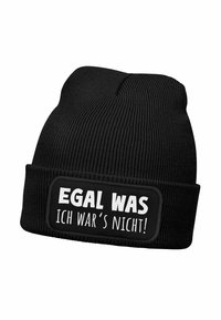 Black knit beanie with a ribbed texture. Features a rectangular patch with white text: "EGAL, WAS ICH WAR'S NICHT!" in bold font.