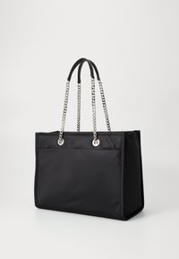 Black tote bag made of nylon, featuring silver chain handles, a structured shape, and two exterior pockets for storage.