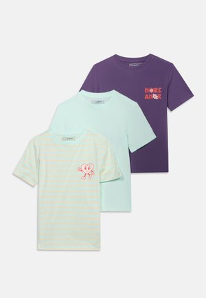 Three short-sleeve t-shirts in purple, light blue, and light striped yellow with pink heart and "More Amor" text designs.