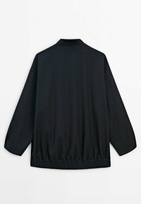 Black collared jacket with long sleeves, elasticated waistband, smooth texture, and no visible patterns or embellishments on the back.