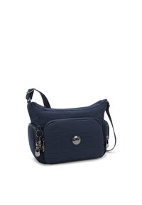 Borsa a tracolla blu navy con tessuto texture, hardware argento, una tasca frontale con cerniera e un portachiavi decorativo. Incluso un cinturino regolabile.