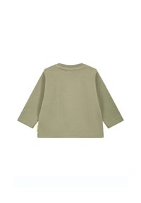 Camicia in cotone verde a maniche lunghe con texture a coste e scollatura rotonda. Presenta un piccolo etichetta sul lato.