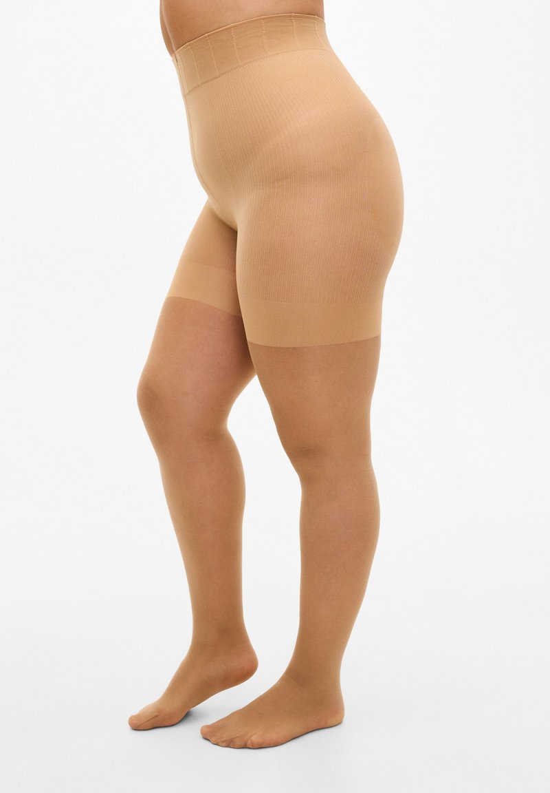 Shorts beige a vita alta modellanti con texture a coste, finitura liscia e fascia in alto, che si estendono fino a metà coscia, progettati per comfort e supporto.