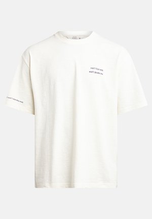White short-sleeve t-shirt made of soft fabric. Features printed text on the front and sleeve. Relaxed fit, round neck design.