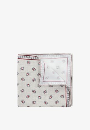 Skarpetka kwadratowa w jasnym beżu z czerwonymi i niebieskimi okrągłymi wzorami; wykończona kontrastującą bordiurą z owalnymi kształtami.